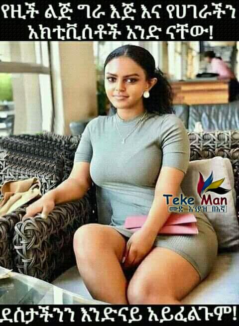 a woman sitting on a couch with a book in her hand